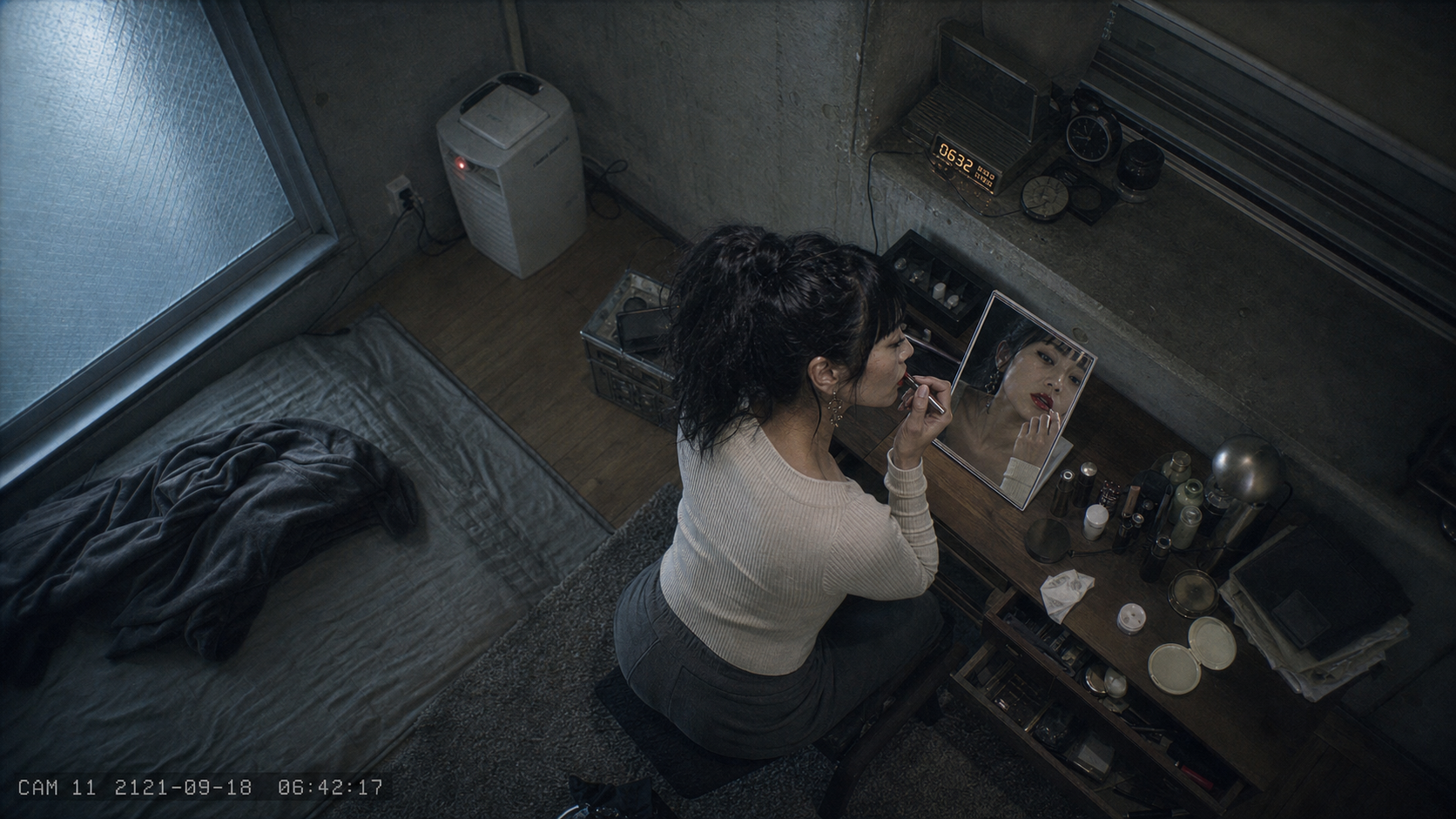 An overhead surveillance view of a woman applying red lip color at a mirror in a concrete apartment.